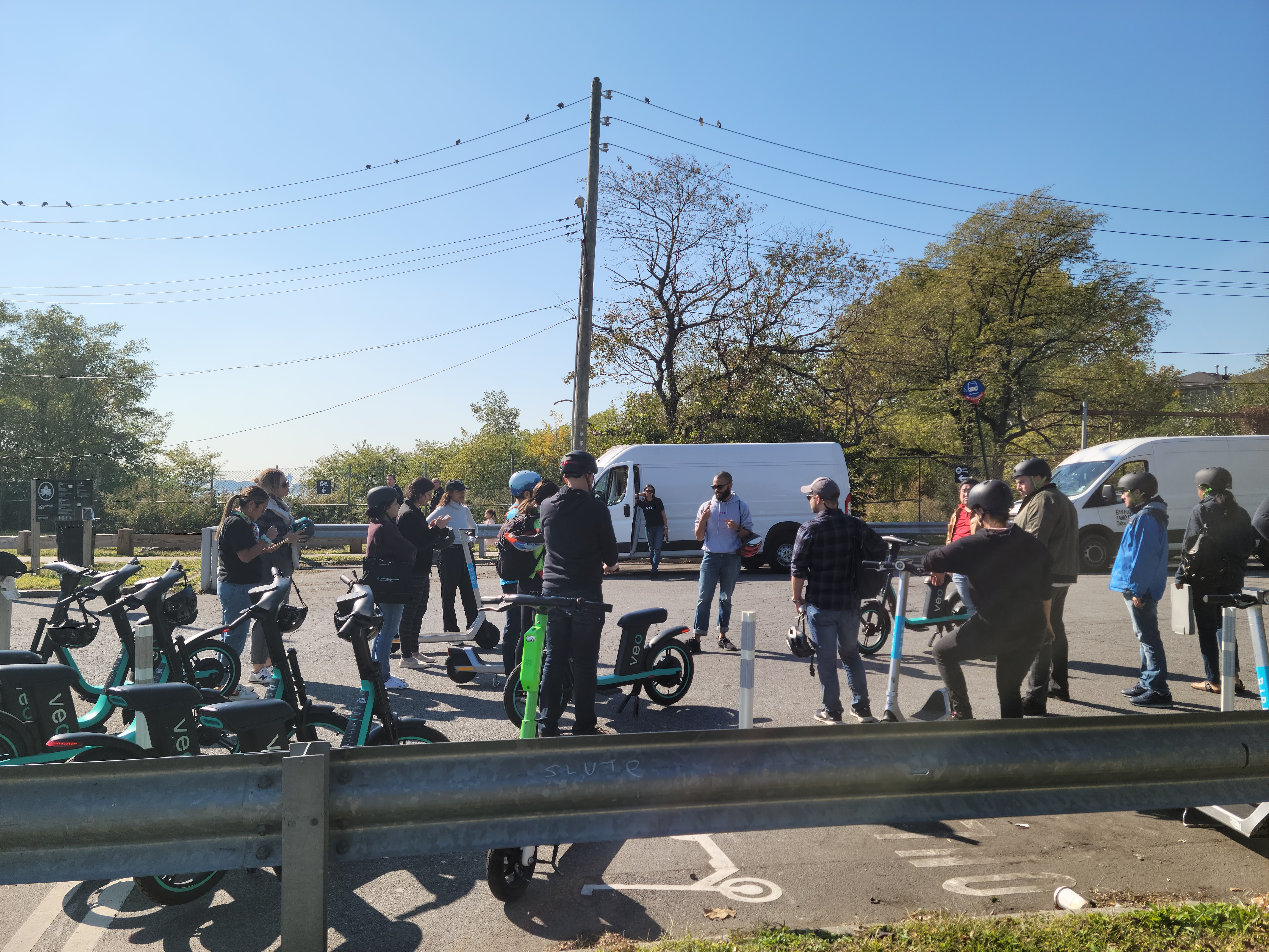 The group in a circle, discussing e-scooters 