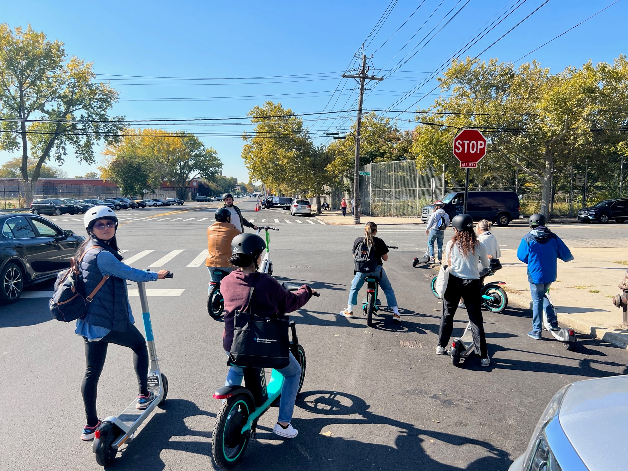 A group of people on e-scooters