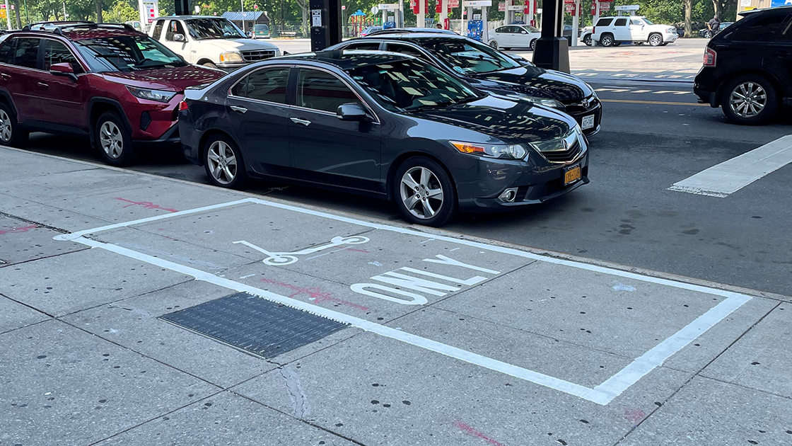 A photo of a parking corral on White Plains Road. 